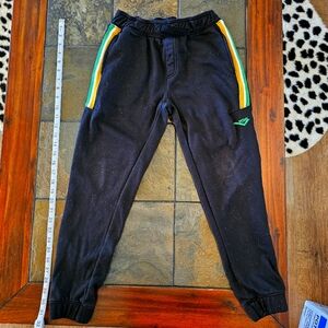 Youth size M (10/12), Pony sweatpants, black with green/white/yellow stripes.